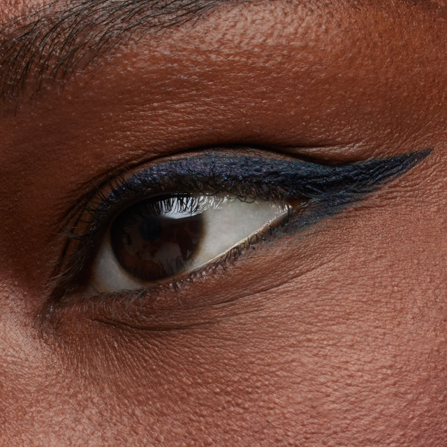 Dark brown eye model wearing Soulgazer in Enigma